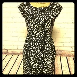 Cap sleeve with unique detailing on neckline.