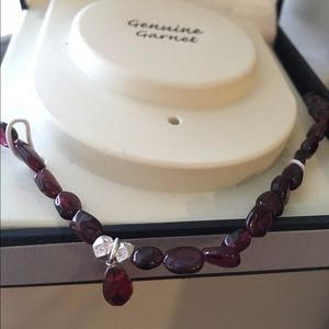 Genuine garnet and sterling silver necklace.