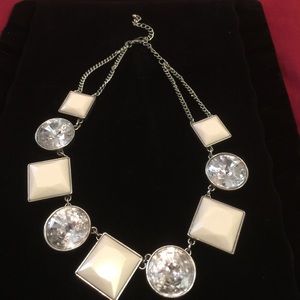 White and silver necklace.
