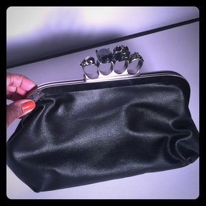 Skull handle leather clutch