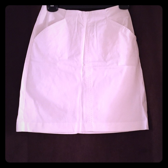 White slight a-line skirt (sits at waist, ~18" L)