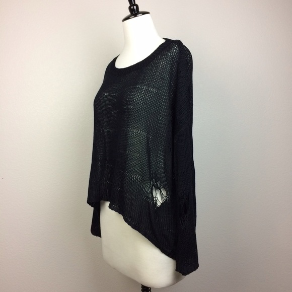 Black knit top with shredded holes details
