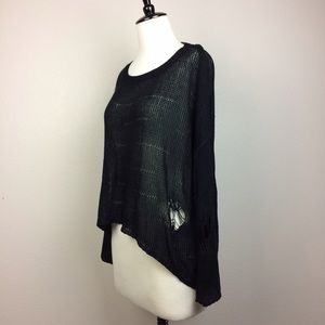 Black knit top with shredded holes details