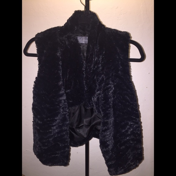 All black faux fur sleeveless vest.