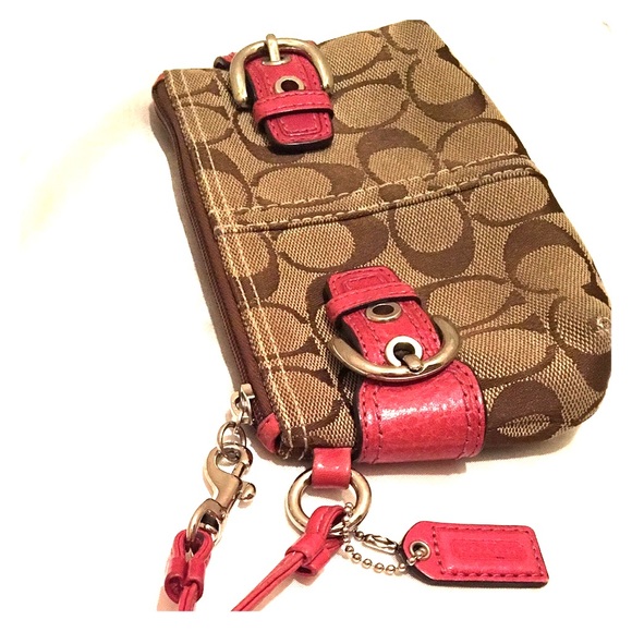 Used - Coach monogram wristlet, pink leather trim