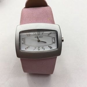Soft suede feel pink band, with silver case.