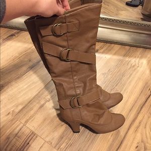 Tan boots hit under the knee