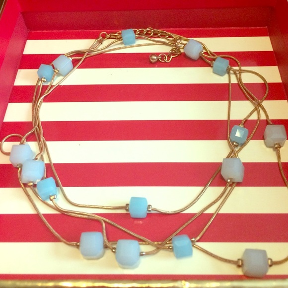 Very cute goldish lite blue necklace