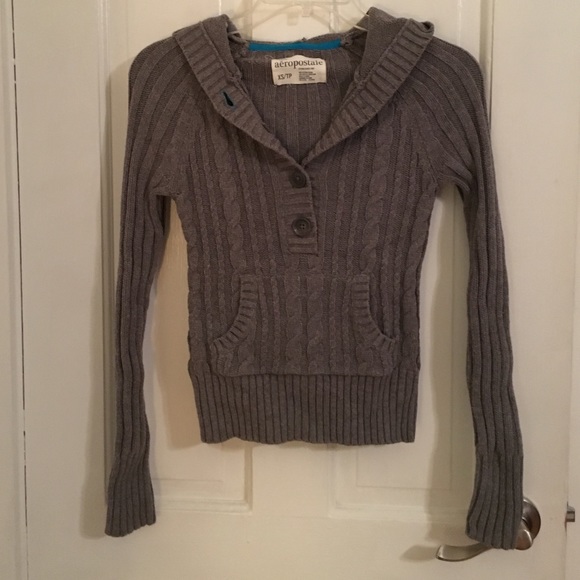 Hooded cable knit pull over sweater.