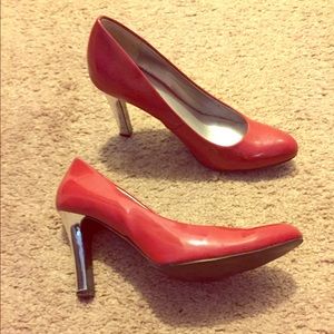 Red and silver patent leather pumps