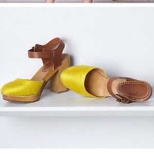 Anthropologie holding horse clogs Anthropologie holding horse clogs