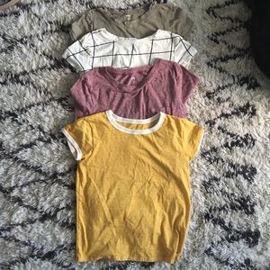 Four XS/S crop tops from urban outfitters and AE