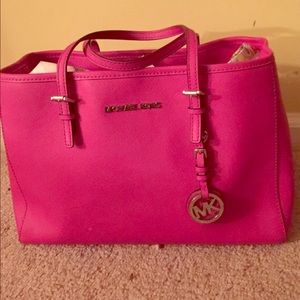 Michael Kors Medium hot pink handbag.