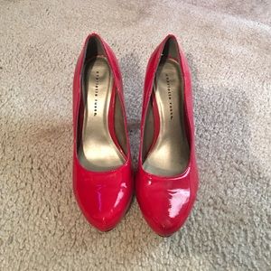 Red patent leather pumps