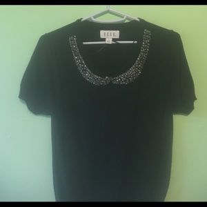 black short sleeved top with sequins around neck