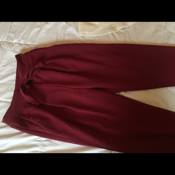 Maroon dress pants with pockets.