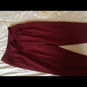 Maroon dress pants with pockets.