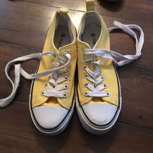 Yellow tennis shoes