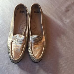 Comfortable gold loafers.