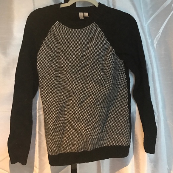 Black sweater with elbow pads.