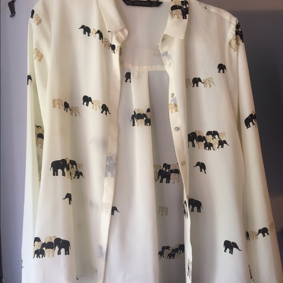 A gold and black elephant blouse.