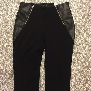 Black pants with leather sides.