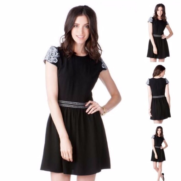 Francesca's black dress with embroidered sleeves