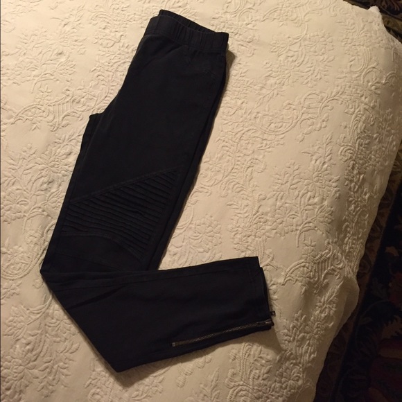 Black/dark gray jeans with the "vent slits"