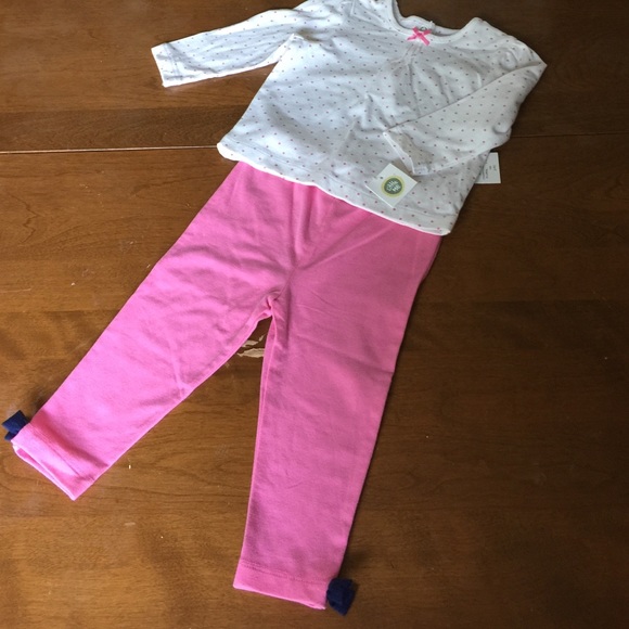 Long sleeve polka dot top and pink bottoms.