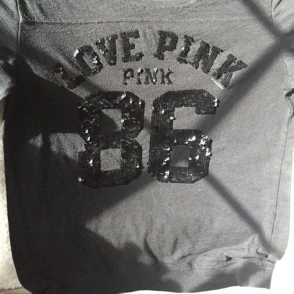 PINK. Black shirt. 3/4 sleeves.