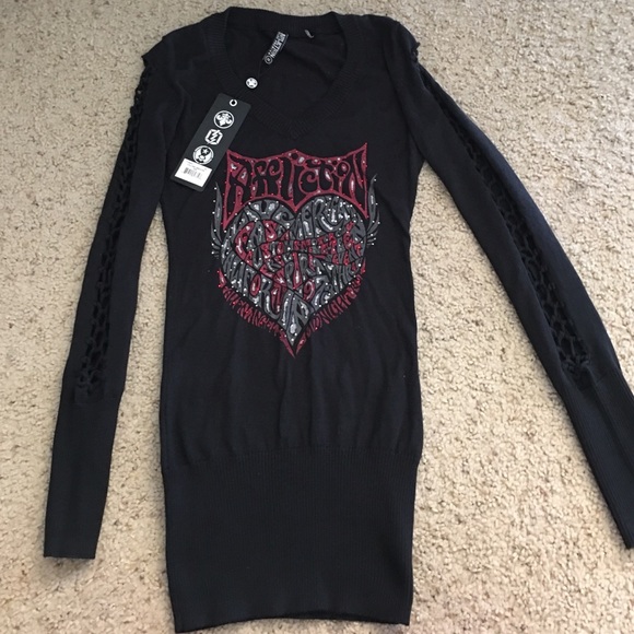 Cute sweater top with cut and Weaved sleeves