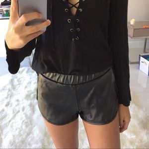 Black faux leather shorts