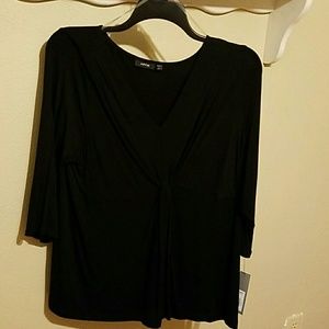 Black top with knot in the front...very flattering