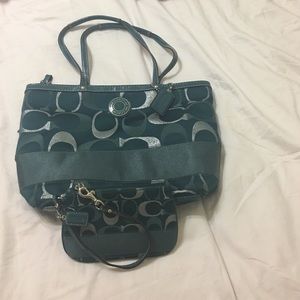 coach teal with silver purse with wristlet.
