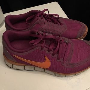 Purple and orange Nike shoes 7.5