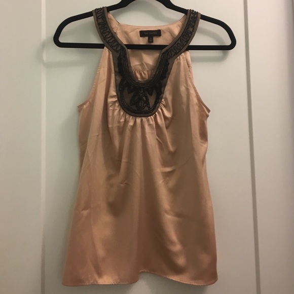 Light pink/champagne sleeveless blouse/shell.