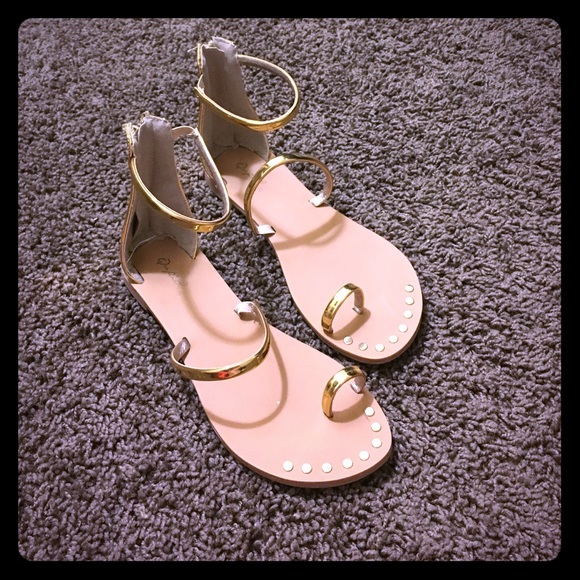 Gold gladiator shoes