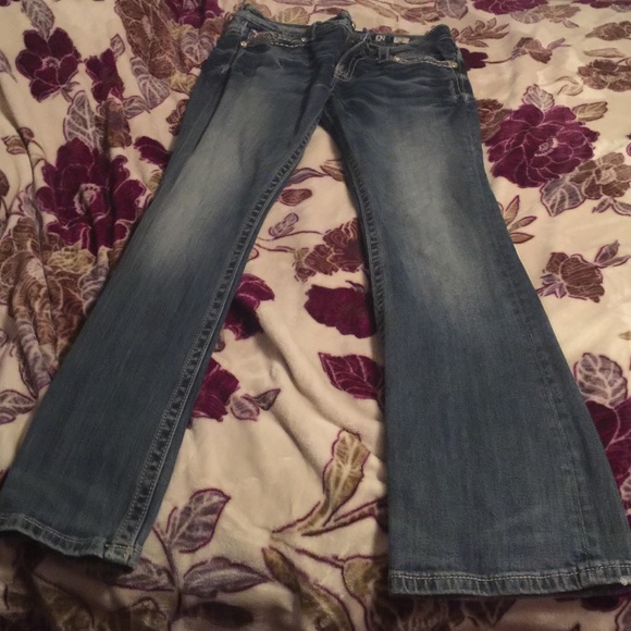 A pair of miss me jeans
