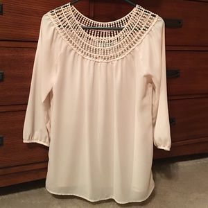 Nice, cream blouse with details on chest