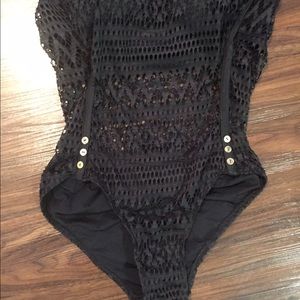 Black one piece swimming suit.