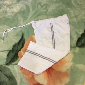 White Capri pants and gray stripes on the side