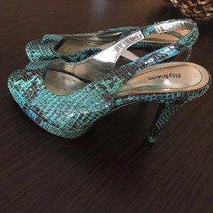 Peep toe snake skin heels