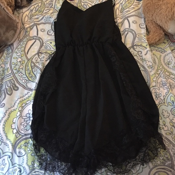 Brand new black romper with lace detail.
