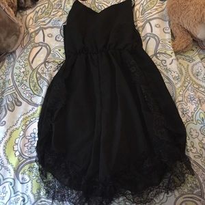 Brand new black romper with lace detail.