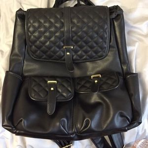 Quilted black leather backpack