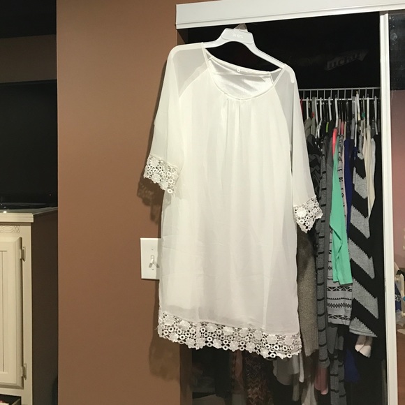 white, long sleeve dress. fits like a medium.