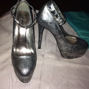 Silver and black studded ankle strapped heels