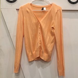 Peach colored button down cardigan