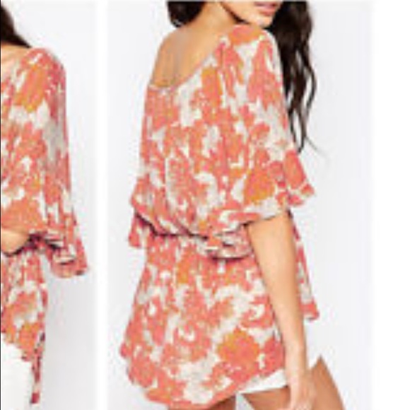 Free People from Anthropologie orange tassel tunic