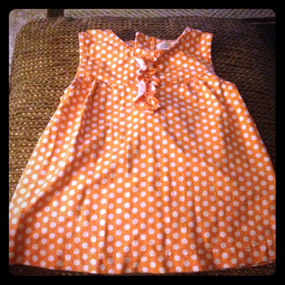 Orange and white polka dot top